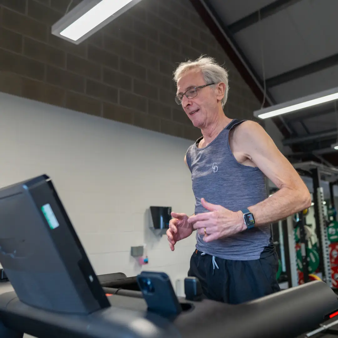 Man running on a treadmill in the gym